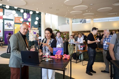 Visitors in conversation during Research Day