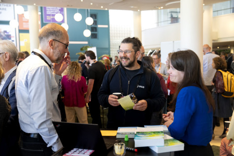 Visitors in conversation during Research Day