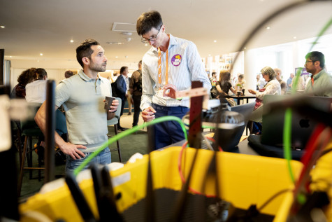 Visitors in conversation during research day