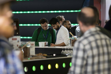 two visitors looking at their phone