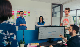 People in an office, laughing