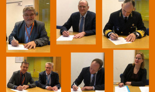 Floor Jas van SURF (rechtsonder) ondertekent het NRN-convenant (© NCSC)