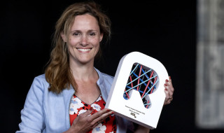 SURF Research Support Champions Awards 2023 - Silvie van Dam with the award