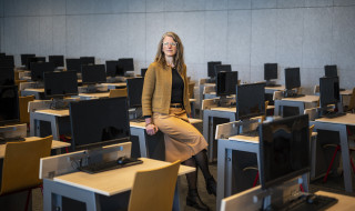 Nolda in the RUG's Aletta Jacobs room where digital testing is taking place, it is full of tables and screens
