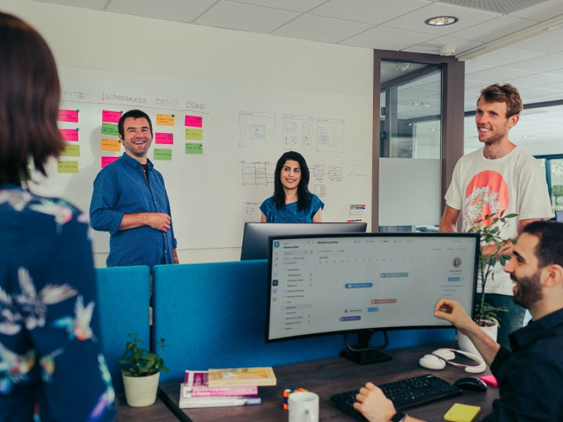 People in an office, laughing