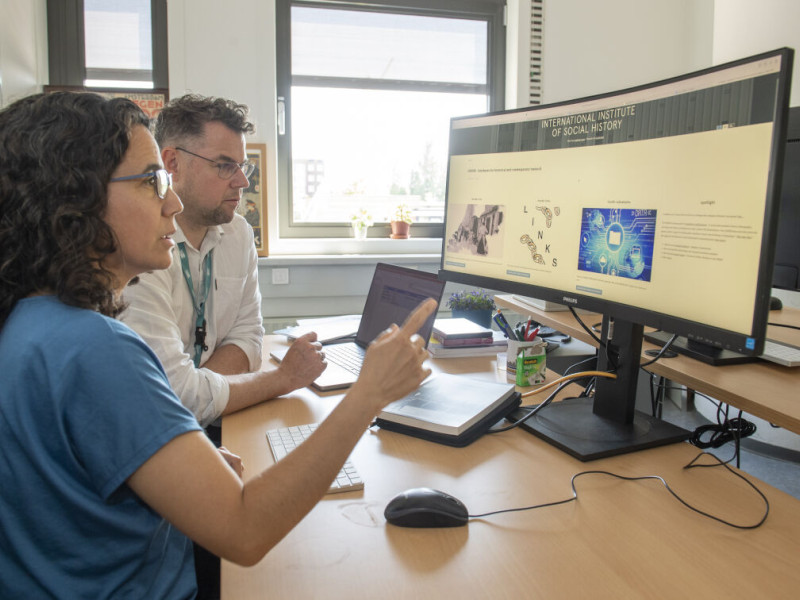 Two researchers at the International Institute of Social History in Amsterdam
