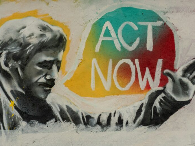 Graffiti met de tekst act now